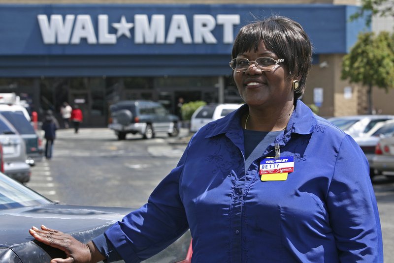 Walmart employee Betty Dukes stands in front of a Walmart in Pittsburg, Calif. As the first “named plaintiff” in Dukes v. Walmart, the ordained Baptist minister also is the face of the largest gender bias class-action lawsuit in U.S. history.
