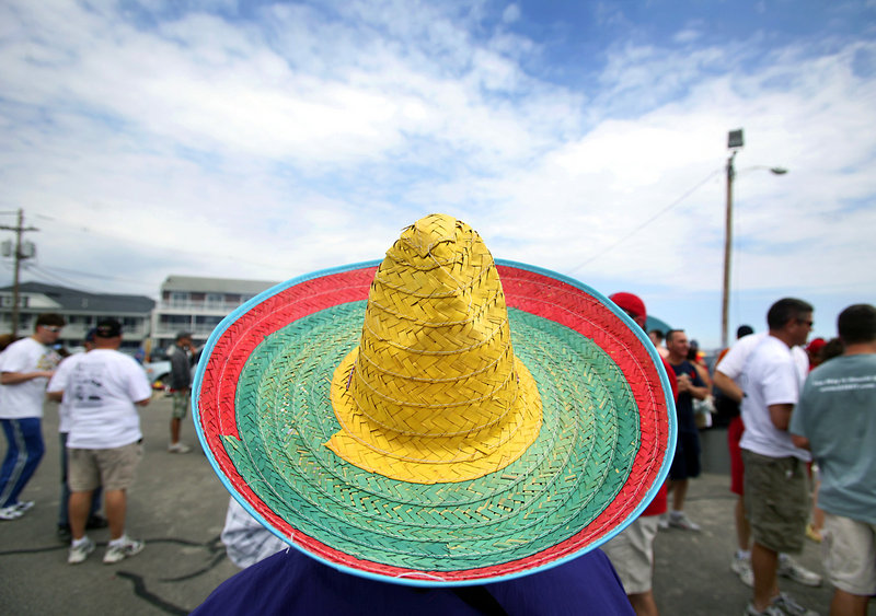 Jacki Jones, a member of the board of directors of the Ogunquit Chamber of Commerce, wears a sombrero Saturday during the Cinco de Mayo-inspired beach barbecue after the Beach & Bay 5K Run or Walk for AIDS. Jones later led barbecuers in a Mexican hat dance.