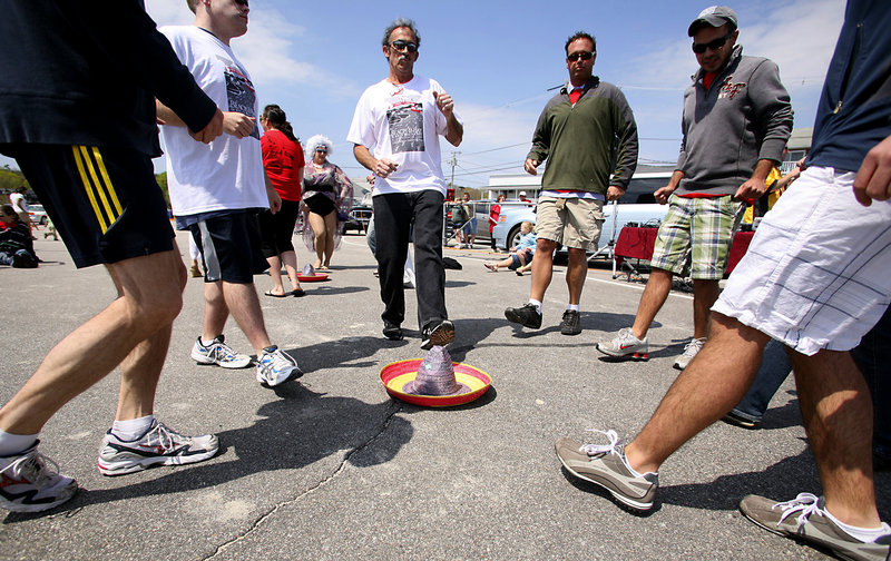 Feet that just finished walking or running 5 kilometers get more of a workout doing the Mexican hat dance at the beach barbecue after the Beach & Bay 5K Run or Walk for AIDS.