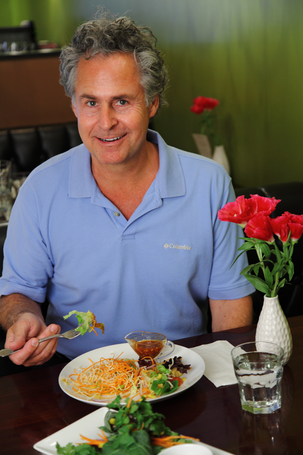 Dr. John Herzog enjoys a vegan meal at the Green Elephant Vegetarian Bistro. He'll be bringing his message of how to improve your health with better diet to Little Lads Bakery during free lunchtime talks every Wednesday this month.