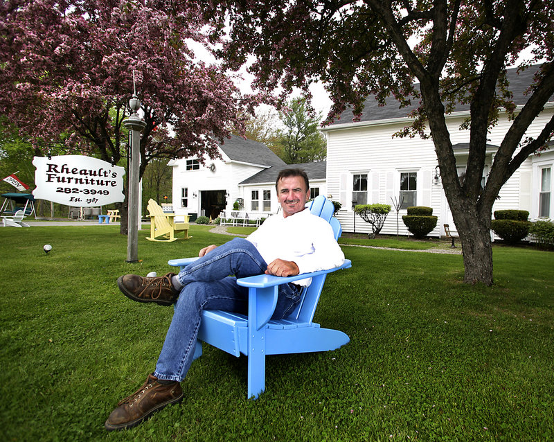 Roger Rheault, owner of Rheault’s Furniture, sits in an Adirondack chair he created at his home in Biddeford. Self-taught, he’s been making furniture since 1987. He says he enjoys every day of it.