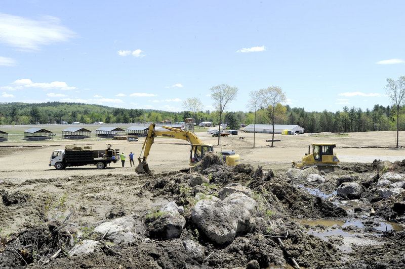 Heavy equipment clears the site behind the Oxford Fairgrounds where promoter Frank Chandler will run the Nateva Music & Camping Festival this summer.