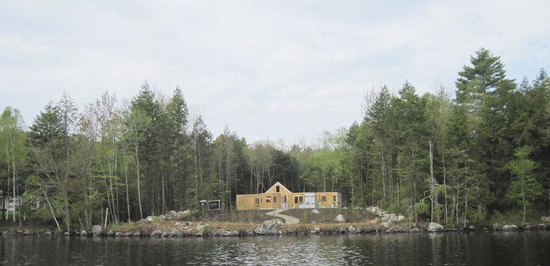 A photo taken Sunday shows replanting on a Long Lake property that was cleared of vegetation. The landowner's lawyer has said poor communication led to the clearing issues.
