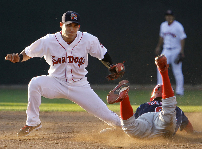 Quintin Berry of the Reading Phillies steals second base Wednesday night as Jose Iglesias of the Portland Sea Dogs takes the late throw in the third inning of the Phillies' 2-1 victory at Hadlock Field. Portland pitcher Casey Kelly was taken off his pitch count and went five strong innings.
