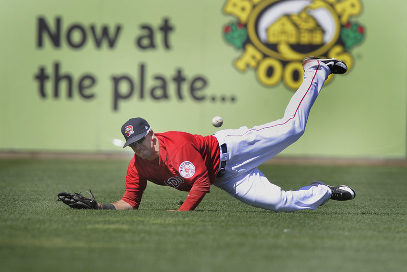 Sea Dogs right fielder Ryan Kalish makes a diving bid but fails to make the catch Thursday at Hadlock Field against the Reading Phillies. Kalish had a two-run single to help Portland rally to a 7-6 victory in the finale of a six-game homestand.