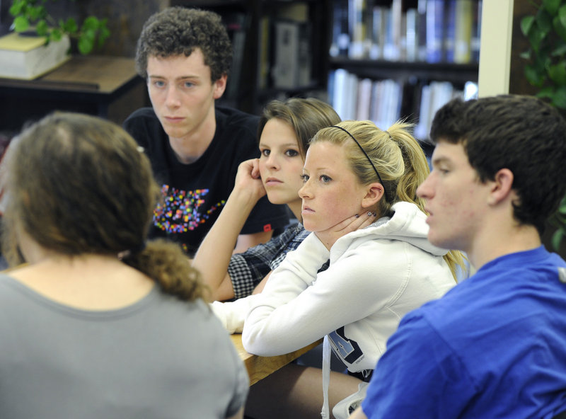 Lake Region seniors, from left, Shep Hayes, Megan Wandishin, Abby Hancock and Zach Tomkinson join a discussion about the state of the school, pictured below. Among the district’s goals is a renewed emphasis on improving SAT scores.