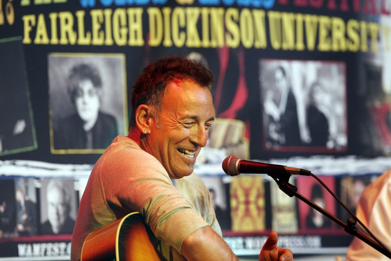 Bruce Springsteen smiles as he sits on stage at Fairleigh Dickinson University on Thursday. Less than a week after his induction into New Jersey's Hall of Fame, rocker Springsteen performed for students at the Madison, N.J., school and talked to them about songwriting.