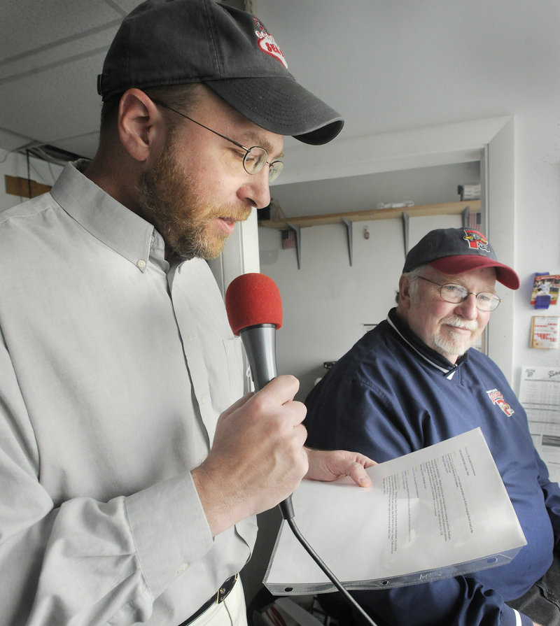 Reporter Ray Routhier tries out the job of public address announcer for a Portland Sea Dogs game at Hadlock Field with veteran announcer Dean Rogers.