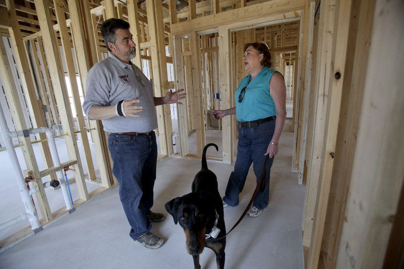 Dave Hamilton of Excalibur Builders in Slinger, Wis., discusses the progress of new-home construction with homeowner Eva Lehman. Lehman and her husband, Daryl, had a difficult time securing financing for their green-built home due to the lack of comparable sales in the area, a necessary and scrutinized portion of real estate appraisals.