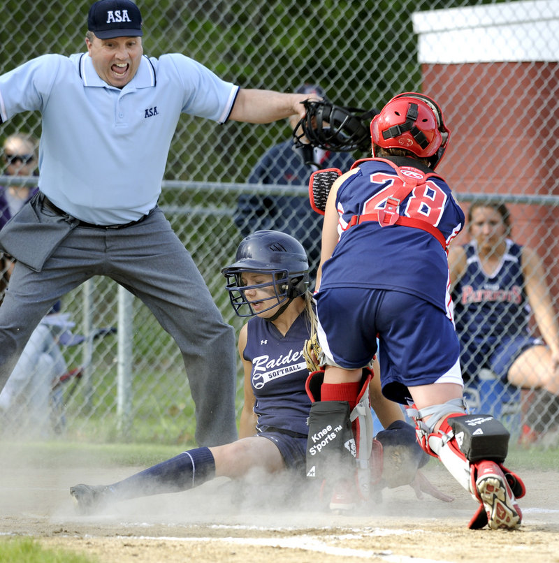 Brylie Walker of Fryeburg Academy slides safely across the plate Friday as Gray-New Gloucester catcher Sammie Wilkins applies a late tag. Fryeburg won the game between undefeated Class B teams, 10-4.