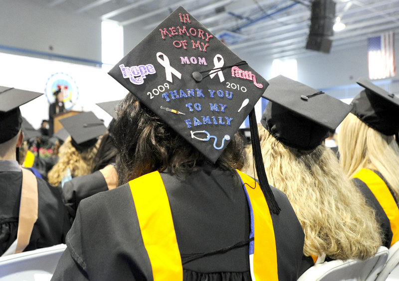 Sarah Fox wears her appreciation as she and 400 others graduate Saturday. Fox’s mother died about a year ago, making commencement even more poignant for Fox.