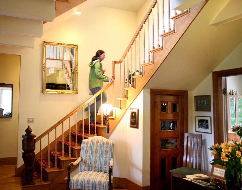 Leah Ingraham of Rockport walks up the grand staircase at the Hawthorn Inn.