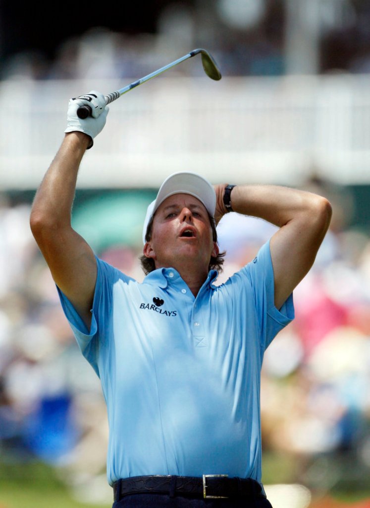 Phil Mickelson reacts Saturday after missing a chip for eagle on the 16th hole at The Players Championship. Mickelson shot a 66 to climb back into contention.