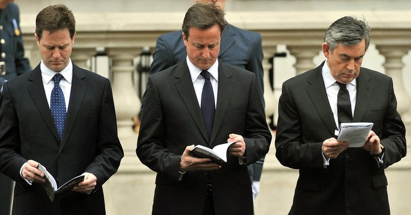 Gordon Brown, right, Britain’s prime minister and leader of the Labour Party, Liberal Democrat Party leader Nick Clegg, left, and Conservative Party leader David Cameron attend a VE Day service in London on Saturday. The Conservative Party fell 20 votes short of a majority on Thursday.