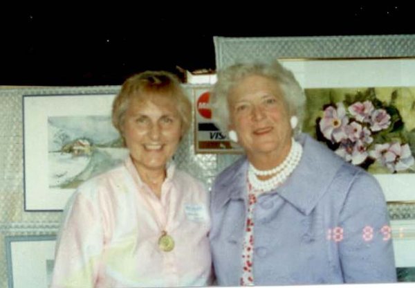 Marjorie "Marnie" Souza, left, poses with former first lady Barbara Bush. Mrs. Souza painted an unsolicited portrait of the Bushes' dog, Millie.