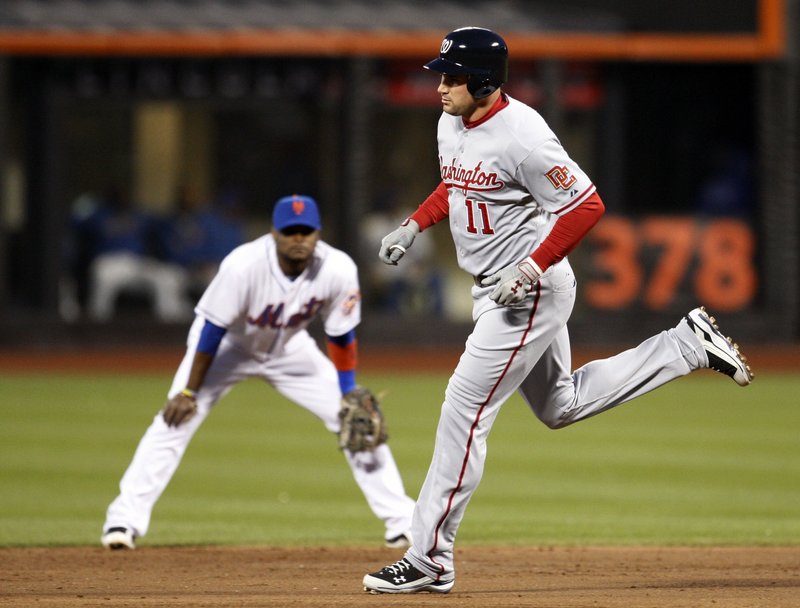 Ryan Zimmerman of the Nationals trots past Mets second baseman Luis Castillo after hitting a third-inning solo home run in Monday night’s 3-2 win at New York.