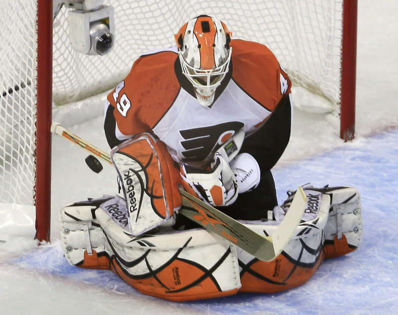 Michael Leighton replaced injured starter Brian Boucher in the second period and made 14 saves in the 4-0 win.