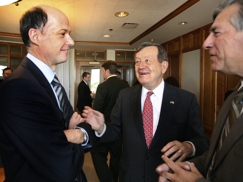 French Consul General Christophe Guilhou, left, visits Tuesday with Preti Flaherty attorney Severin Beliveau, middle, and Joe Lee, president of Saint Joseph’s College in Standish.