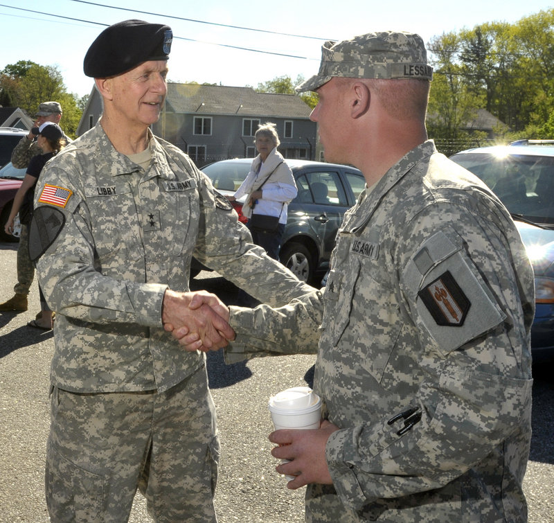 Maj. Gen. John Libby, state adjutant general, shakes hands with Sgt. Cory Lessard May 5 at a send-off for Lessard’s Reserve unit, which is headed for Iraq.