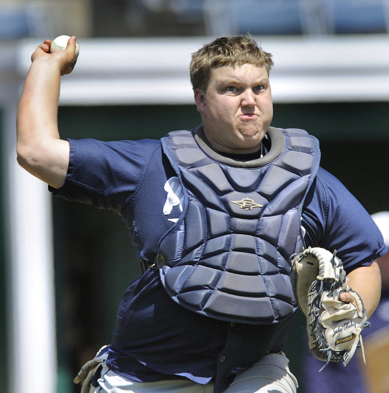 Penn State Greater Allegheny catcher Josh Kubisz comes up throwing and gets a Southern Virginia runner at first base.