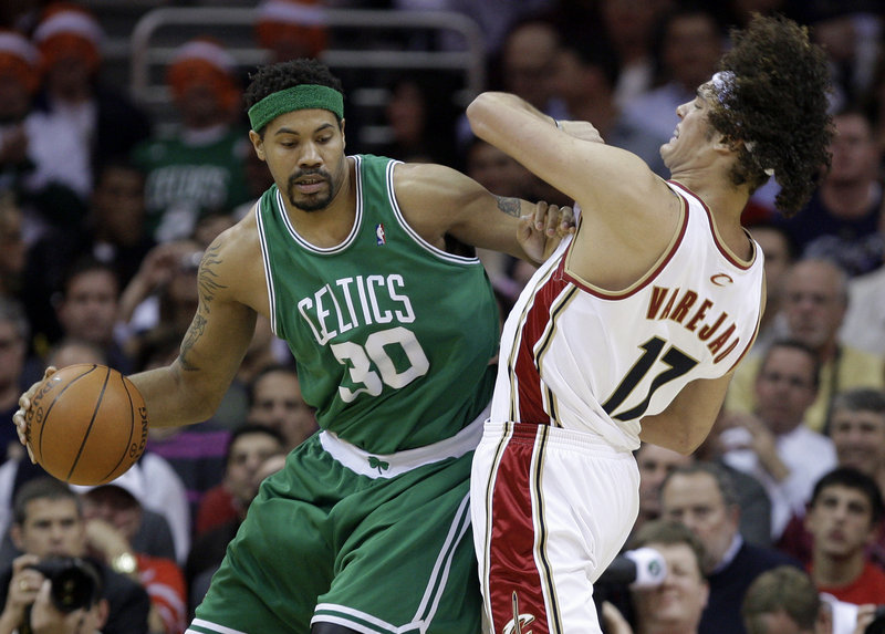 Rasheed Wallace of the Boston Celtics attempts to gain room Tuesday night while guarded by Anderson Varejao of the Cleveland Cavaliers. Boston won, 120-88.