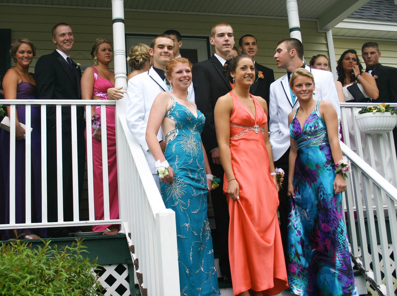 Standing at the front of the crowd of well-dressed South Portland High School prom-goers last Saturday, Karleigh Bradbury, Alexis Bogdanovich and Danielle Dibiase wear gowns that show the popularity of embellishments, bright colors and printed fabrics.