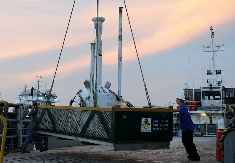 This image provided by the Deepwater Horizon Unified Command shows a small pollution containment chamber, known as the “top hat,” being loaded onto the deck of the motor vessel Gulf Protector in Port Fourchon, La., on Monday.