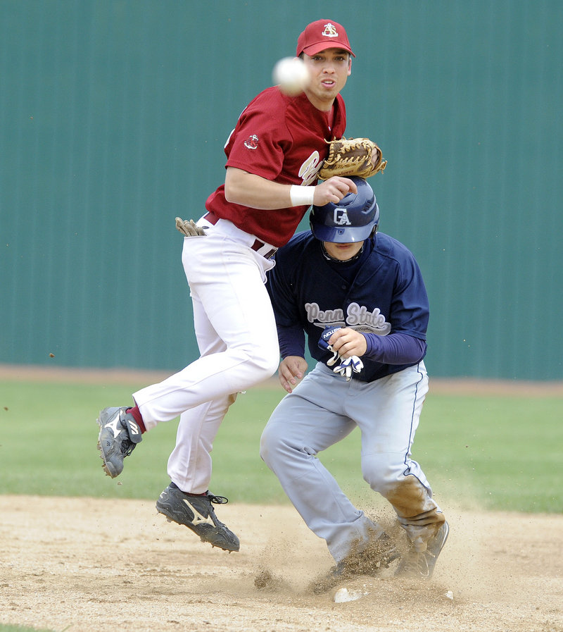 Apprentice School shortstop Josh Tuck zips a throw to first after forcing Mike Visloski of Penn State Greater Allegheny at second base.
