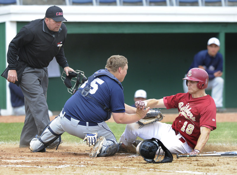 Penn State Greater Allegheny catcher Josh Kubisz tags out Andrew Yonta of the Apprentice School trying to score on a ground ball during a game in the USCAA baseball tournament Wednesday at The Ballpark in Old Orchard Beach.Photos by John Ewing/Staff Photographer