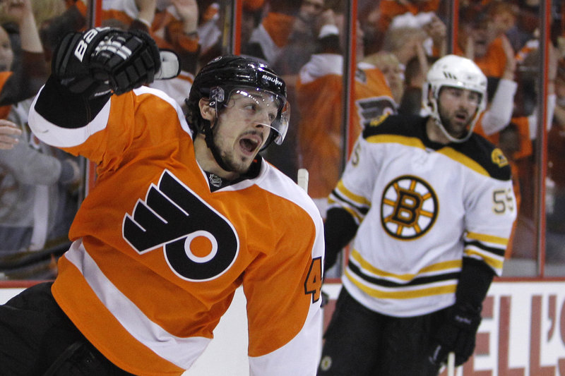 Danny Briere celebrates in front of Boston’s Johnny Boychuk after giving the Flyers a 2-0 lead with a second-period goal.