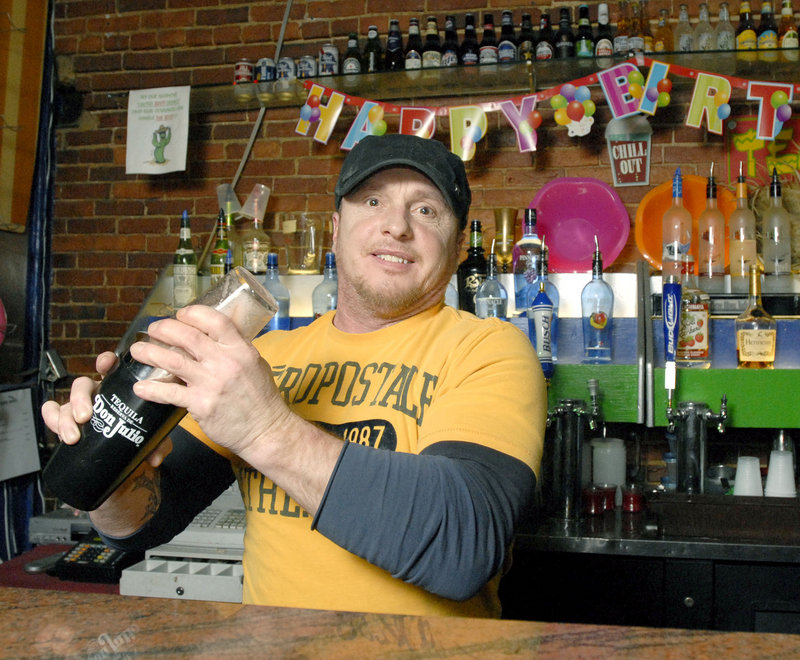 Bartender Mike Ingalls mixes drinks at the Cactus Club in Portland, known as a tourist hotspot and a place where it’s always somebody’s birthday ...or at least you can feel free to party that way.