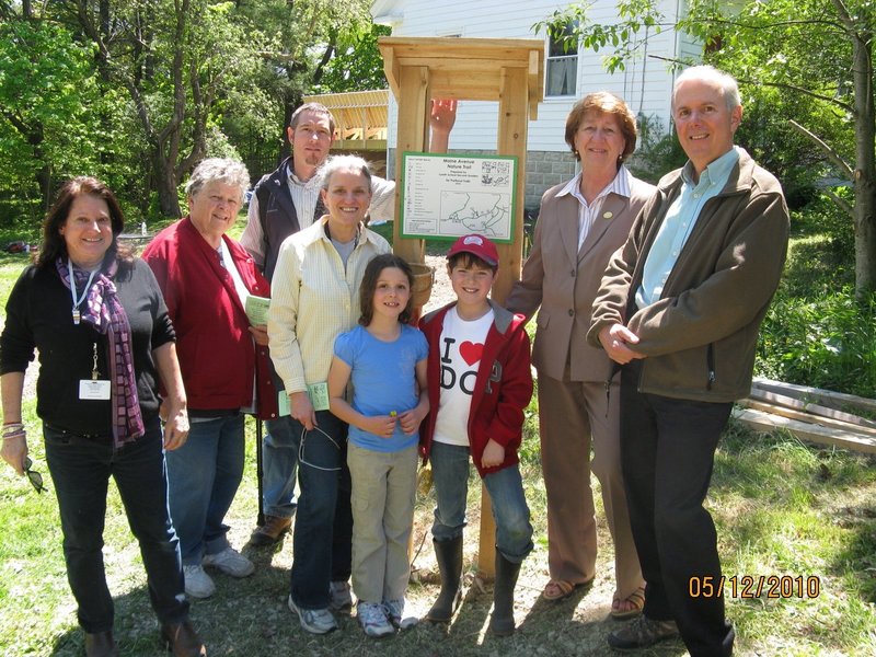 Maine Avenue Trail Workers include, from left, Lyseth teacher Margaret Slocumb, grandmother Katherine Shepard, father Gene McKeen, Lyseth teacher Pat Riley, second-graders Emily McKeen and Aidan Reid, city councilor and representative on the Landbank Commission Cheryl Leeman and Landbank Commission Chairman Tom Jewell.