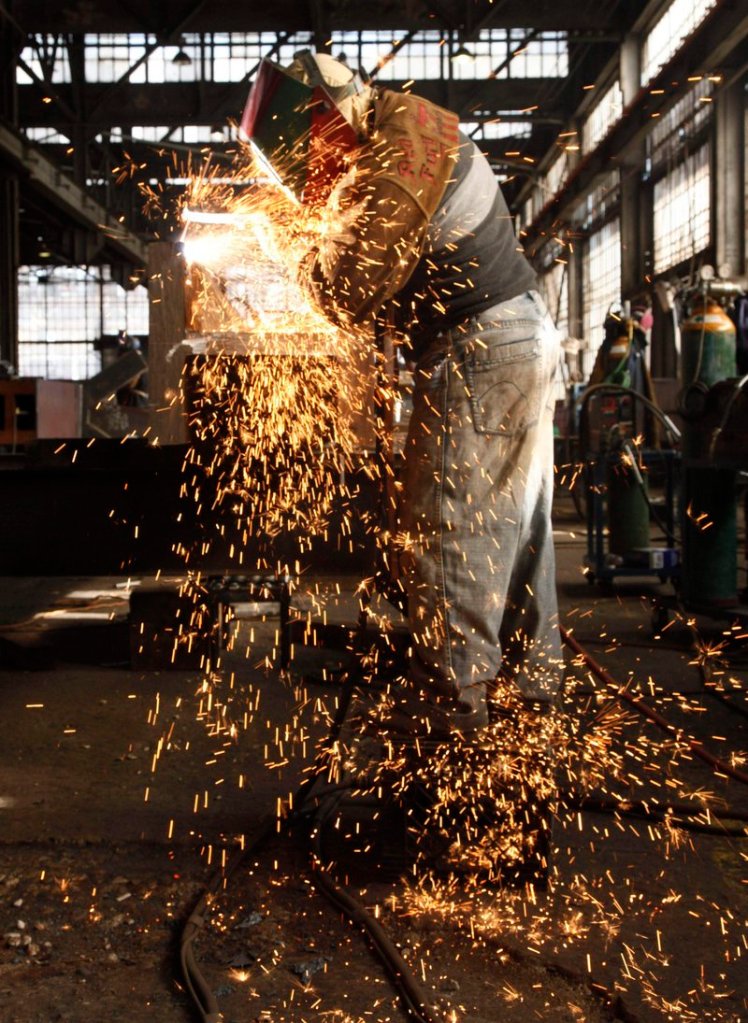 A steelworker at MRP in South Plainfield, N.J., fabricates a steel beam. Industrial production in the United States logged a stronger-than-expected gain in April.
