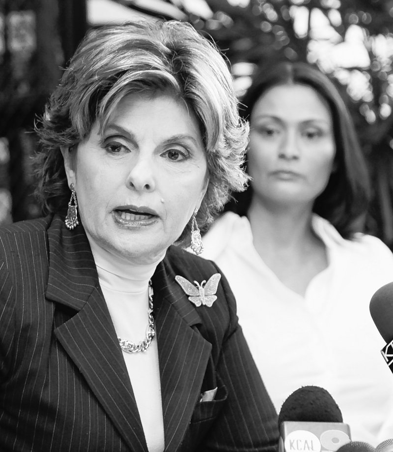 Attorney Gloria Allred speaks for her client, British actress Charlotte Lewis, background, in Los Angeles Friday. Lewis alleges that director Roman Polanski sexually victimized her in Paris when she was 16.