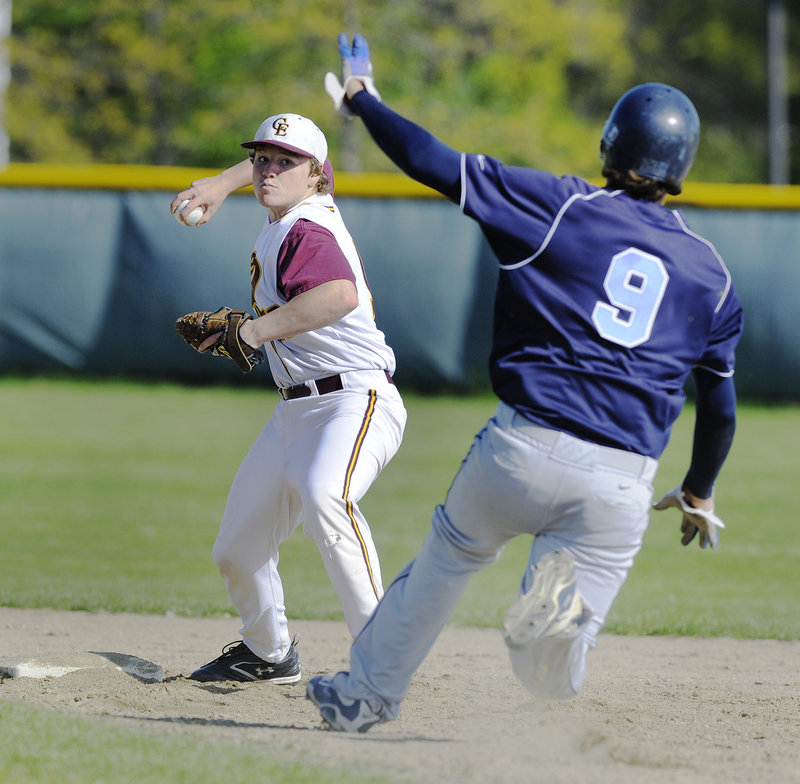Cape Elizabeth second baseman Kyle Piscopo sets to throw to first and complete a double play Friday after forcing Chris Cole of York in the second inning.