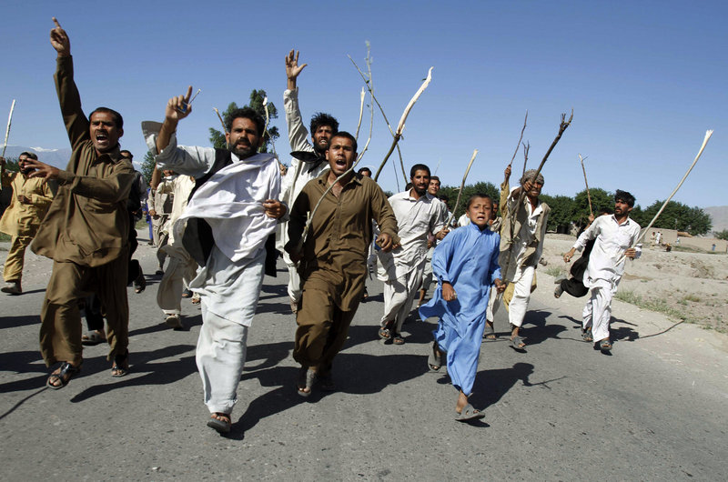 Residents protest the killing of alleged civilians by NATO forces in an overnight raid at Surkhrod, Afghanistan, on Friday.