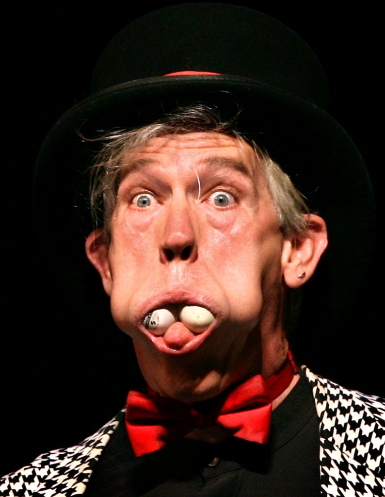 Michael Lane Trautman stuffed ping-pong balls into his mouth during the circus arts performance.