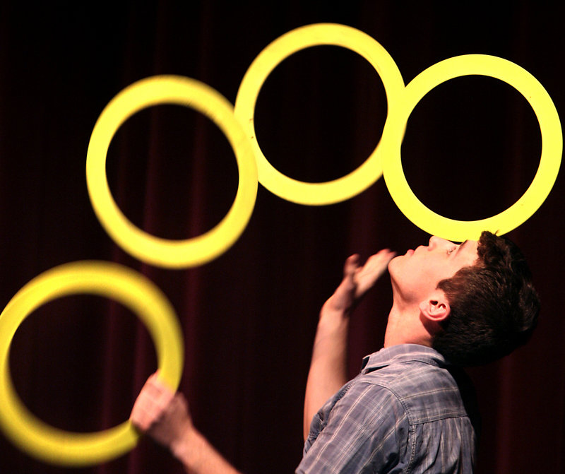 Shane Miclon of Buckfield juggles up to seven rings during the circus arts performances.