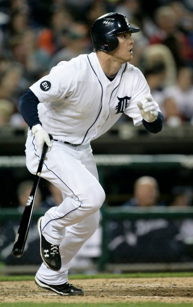 Brennan Boesch of the Detroit Tigers watches his two-run triple sail to center field in the sixth inning Saturday night. The Tigers rallied to beat the Red Sox in 12 innings, 7-6.