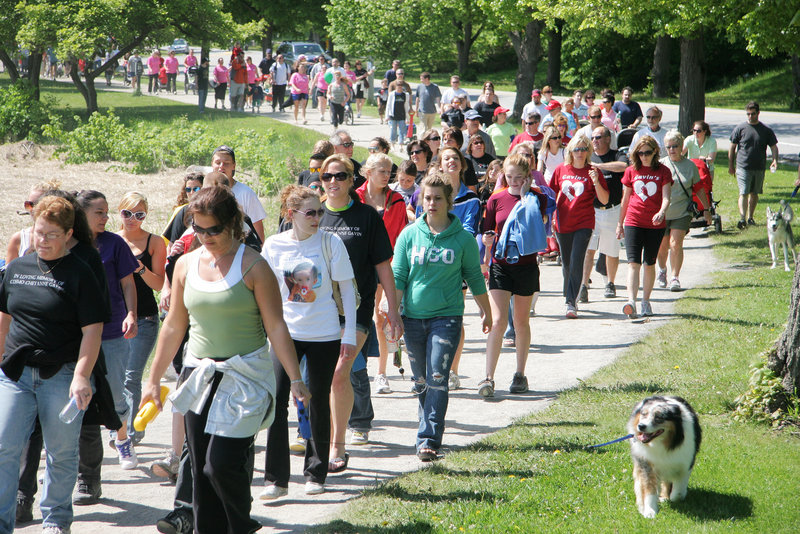 A long parade of people stretches out along Back Cove in Portland during the Southern Maine Heart Walk on Sunday. Some marchers wore various T-shirts identifying “teams” organized to represent the memory of family and friends.