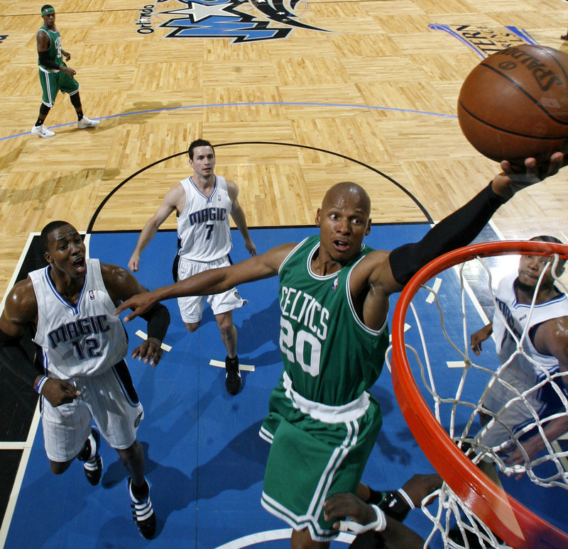 Ray Allen of the Celtics lays in a shot during the first half on Sunday in Orlando, Fla. Allen had 25 points as the Celtics held off the Magic to win the opener in the Eastern Conference finals.