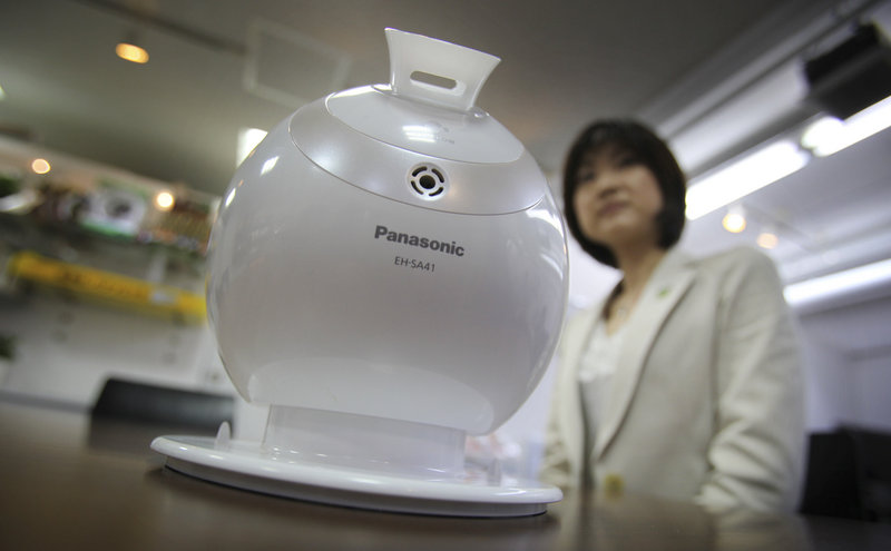Shiori Yamada, manager of Panasonic’s beauty production development team in Tokyo, shows off the Nano Care humidifier, a product she created for busy working women. Panasonic has just 2,000 women among 38,000 managers.