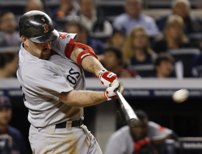 Boston’s Kevin Youkilis hits a two-run home run in the eighth inning, giving the Red Sox a temporary lead.
