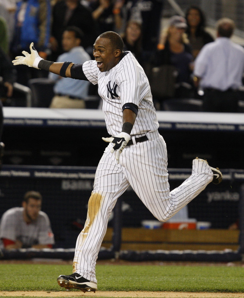 Marcus Thames heads home after hitting a winning two-run homer in the ninth inning to rally the Yankees to an 11-9 victory over the Red Sox Monday night in New York.