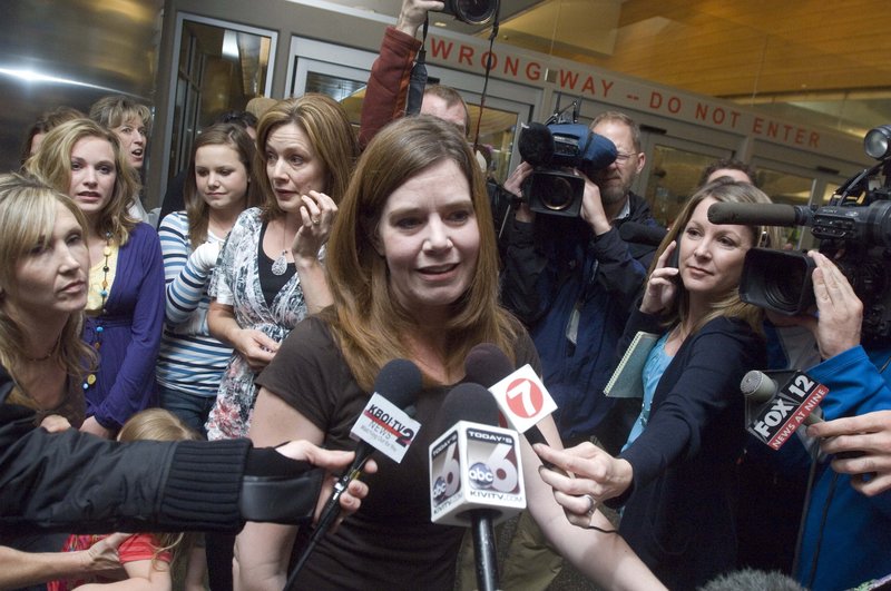 Laura Silsby, the Idaho missionary jailed for three months in Haiti, is surrounded by media after arriving in Boise Tuesday after her release. She was accused of trying to take children from Haiti after the deadly January earthquake.