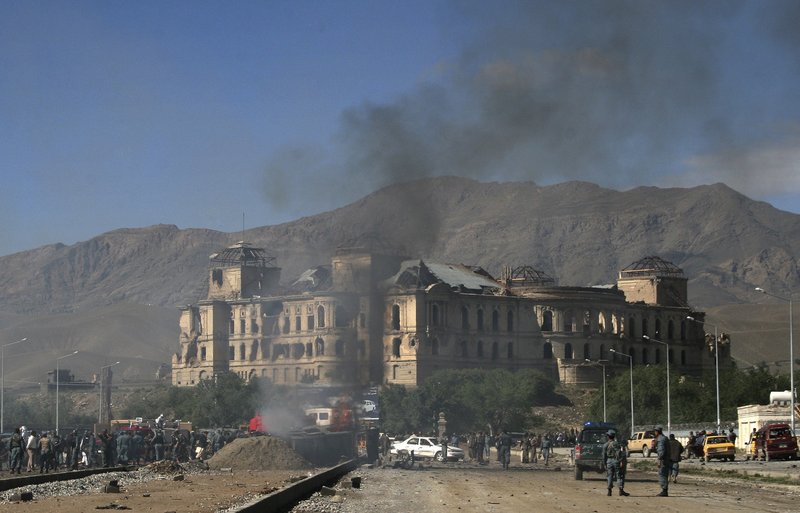 Smoke rises from the street near the Darulaman Palace in Kabul, Afghanistan, after Tuesday's suicide car bombing. The radical Islamist Taliban movement claimed responsibility for the attack, which targeted the front of a NATO convoy.