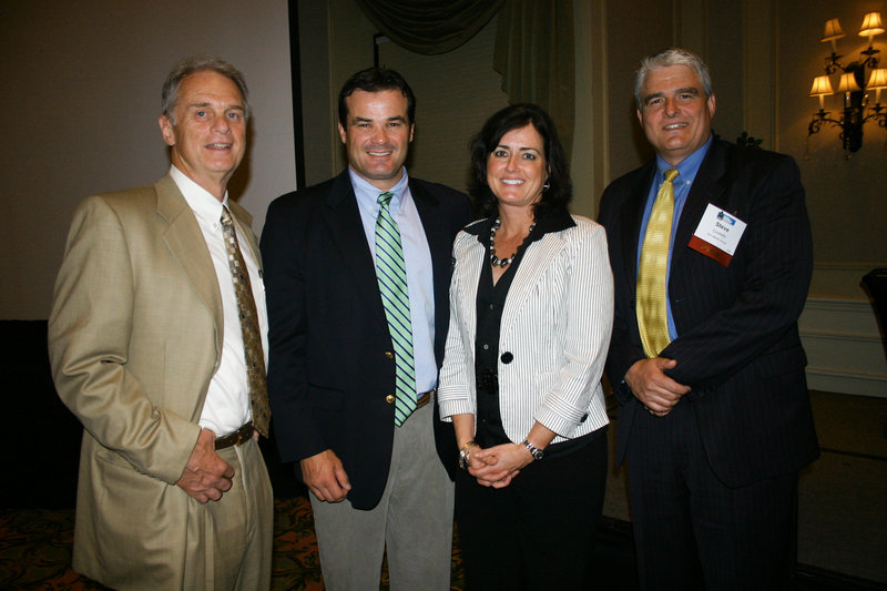 Tom Juenemann, director of the Institute for Family-Owned Business, which sponsored the event, David Wedge, Maureen Costello Wedge, board chair and a member of Sun Media Group, and Steve Costello of Sun Media Group.