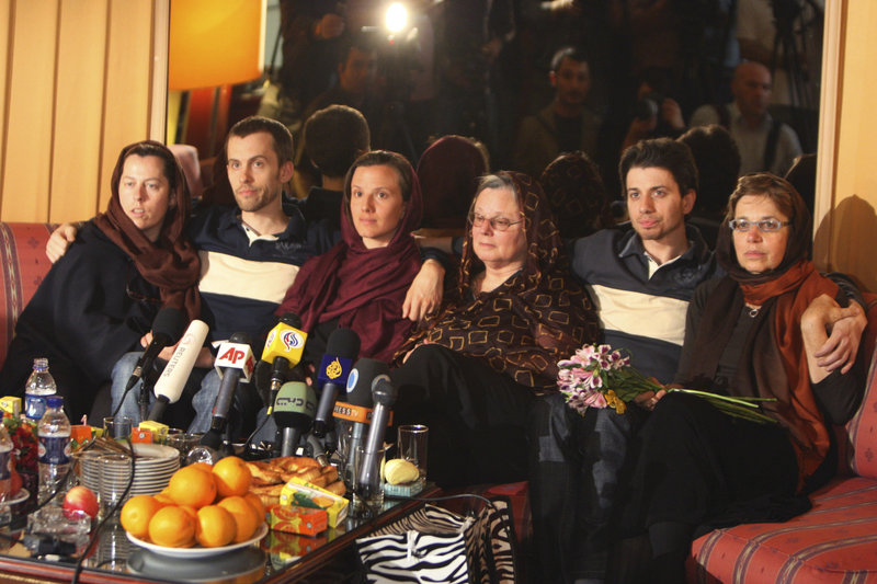 From the right: Laura Fattal and her son Josh, Nora Shourd and her daughter Sarah, and Shane Bauer and his mother Cindy Hickey sit together during a press briefing at the Esteghlal hotel in Tehran, Iran, Thursday. The three Americans, jailed in Iran for 10 months on charges of spying and entering the country illegally, hugged and kissed their mothers in an emotional reunion after the women arrived on a mission to secure their release.