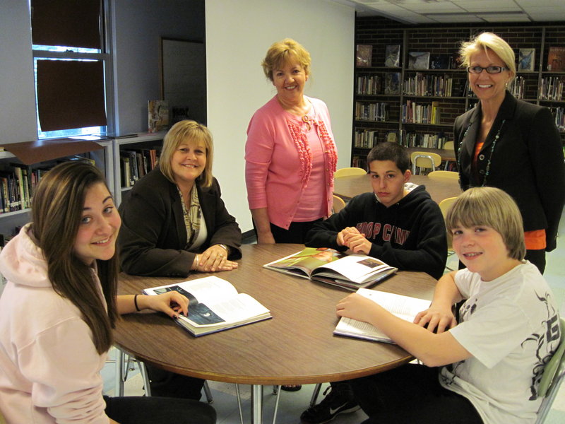 Students at South Portland’s Memorial Middle School are learning the “power of poetry.” Ready for the program are, from left, Antonia Frisco, student; Melanie Lee, manager Saco & Biddeford Savings, South Portland Branch; Nancy Hutto, intervention strategist at the school; Sam Cross, student; Zared Wilvurn, student; and Sherry Dolloff, school librarian.
