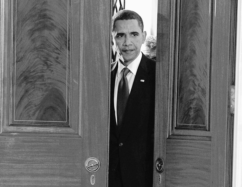 President Obama looks through the door before the start of a news conference in the East Room of the White House in Washington on Thursday, where he announced new restrictions on drilling and drilling permits.